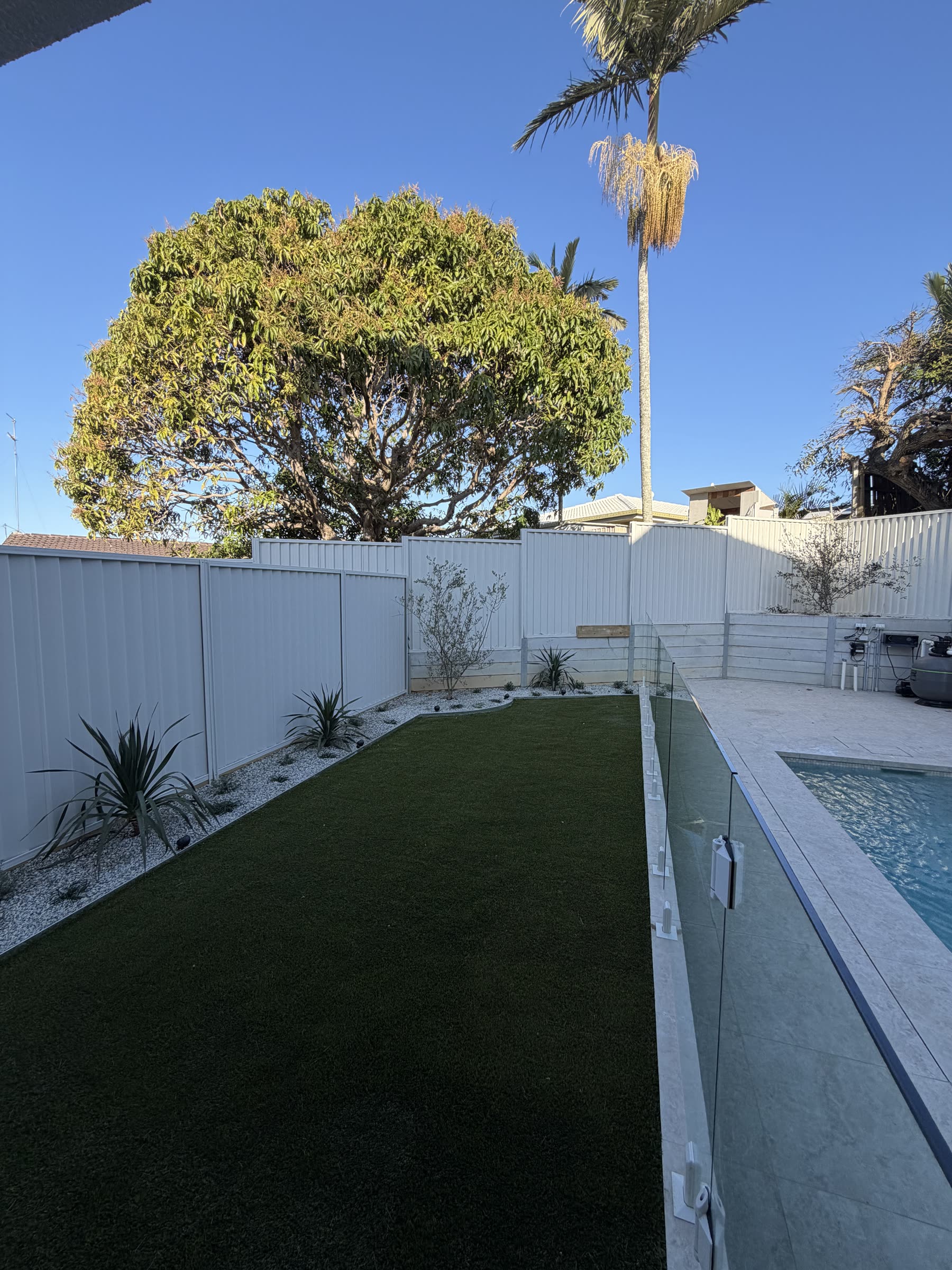 Turf and gardens finished around the pool