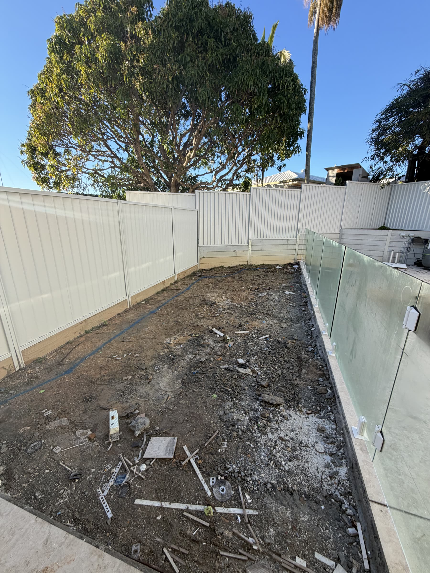 Pool yard stripped to dirt