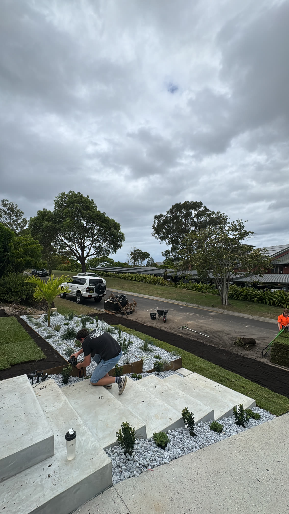 New planting and pebble beds going in around fresh concrete
