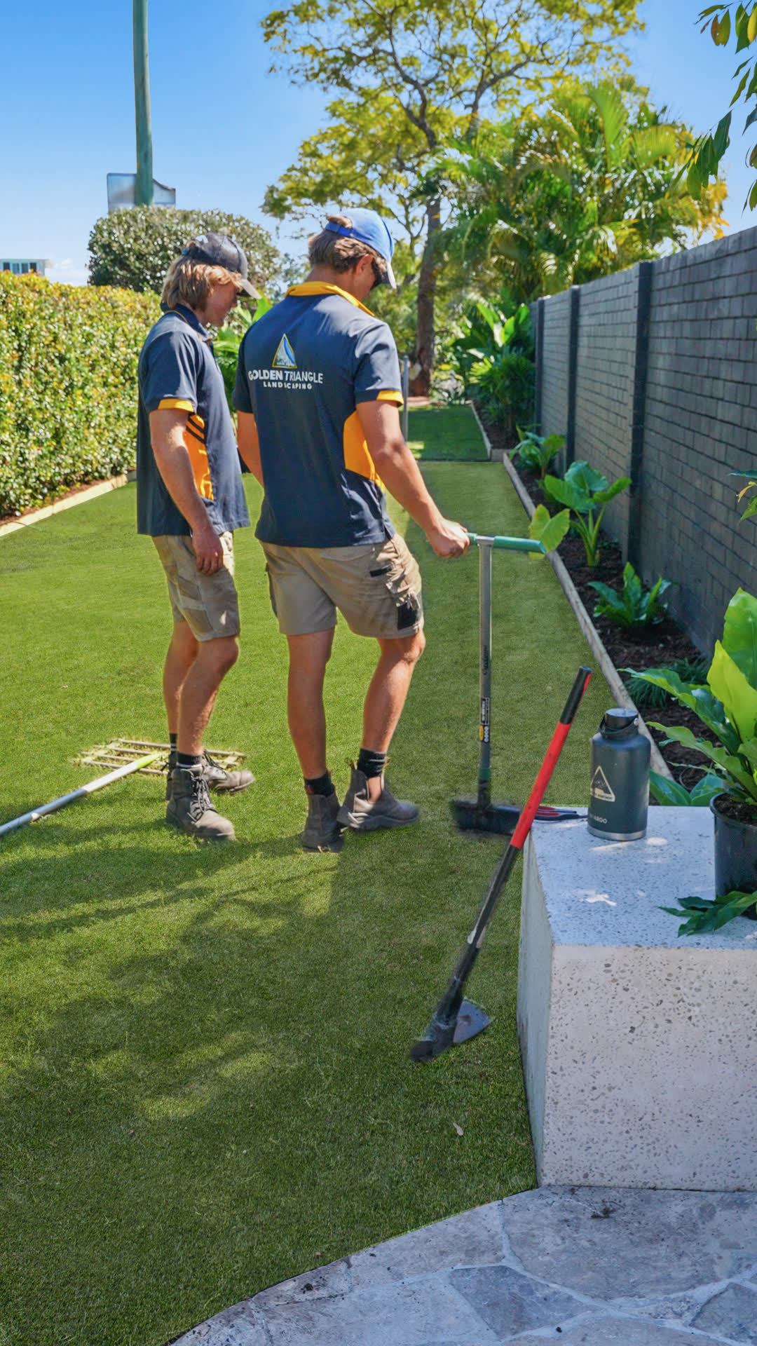 Crew laying new turf, Broadbeach Waters
